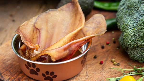 are pig ears better for a small greek domestic dog than rawhide ears